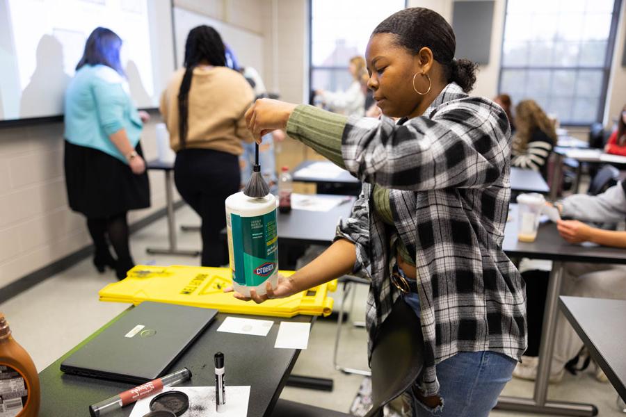 student in a fingerprint class