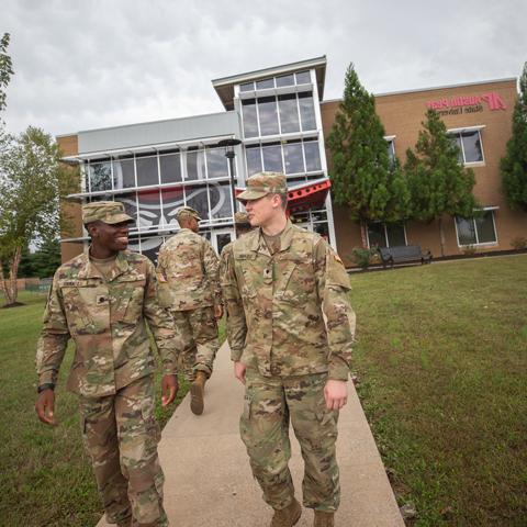 Military students walking in front of the Austin Peay Center at Fort Campbell