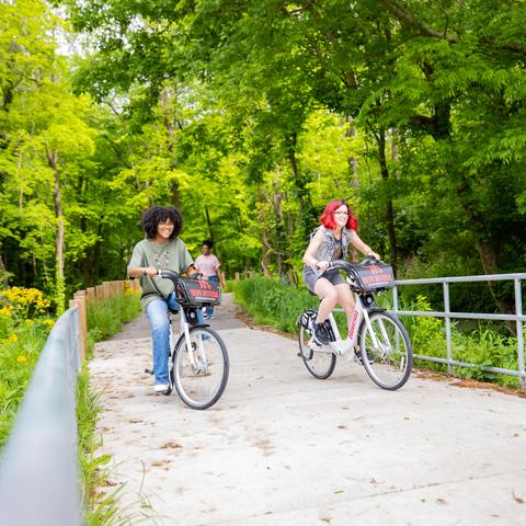 Students riding bikes on the Greenway